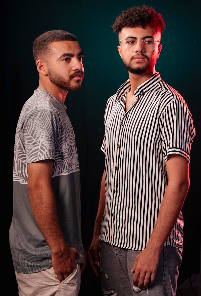 Mastering the First Impression: Your intriguing post title goes here Studio portrait of two young men in stylish outfits, showcasing modern casual fashion.